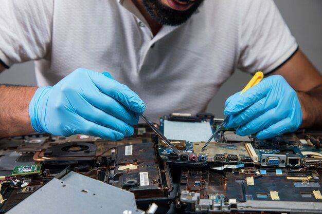 Bali Phone Repair technician assistant working on service documentation